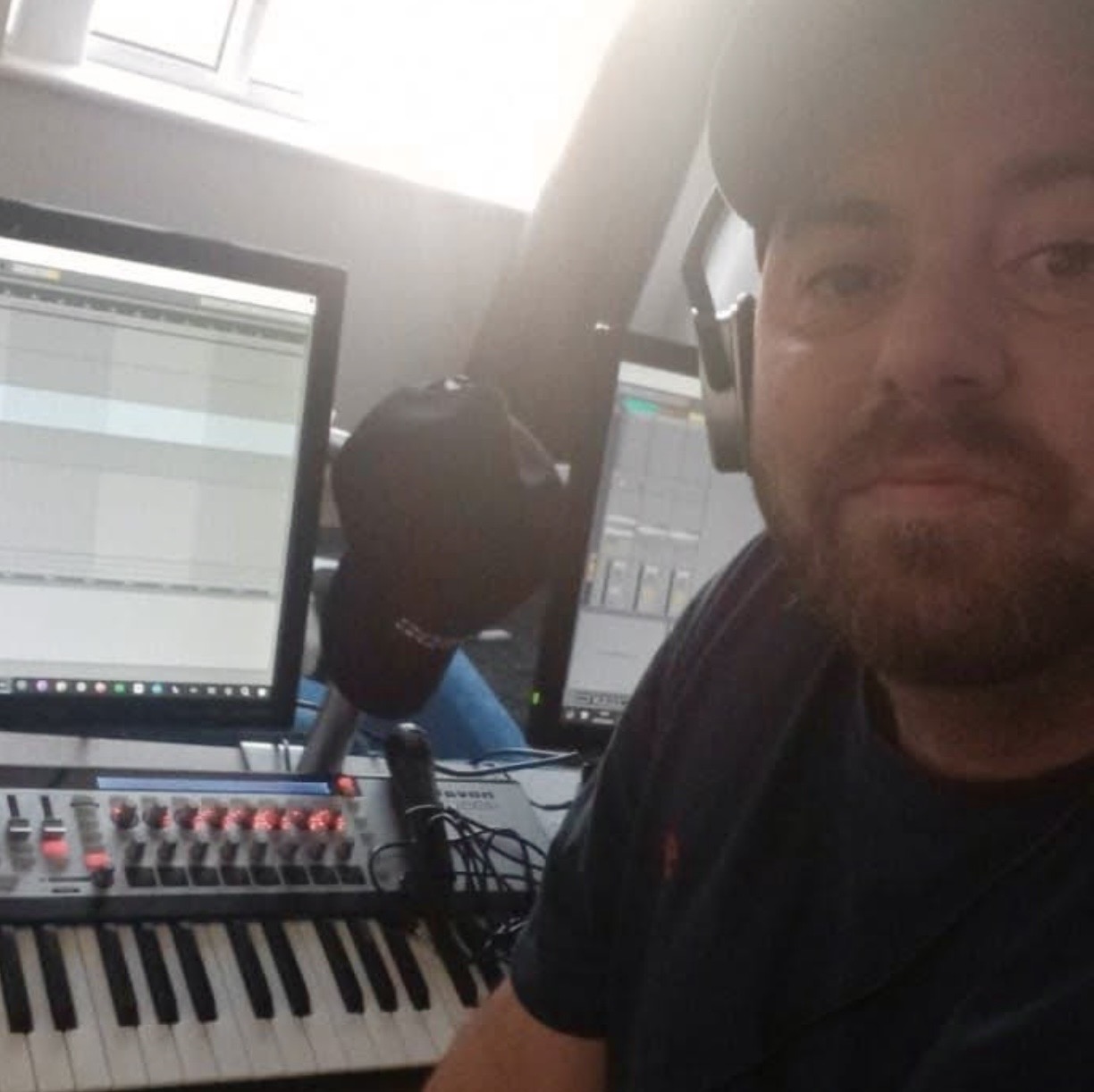Johnny working in a home music production studio